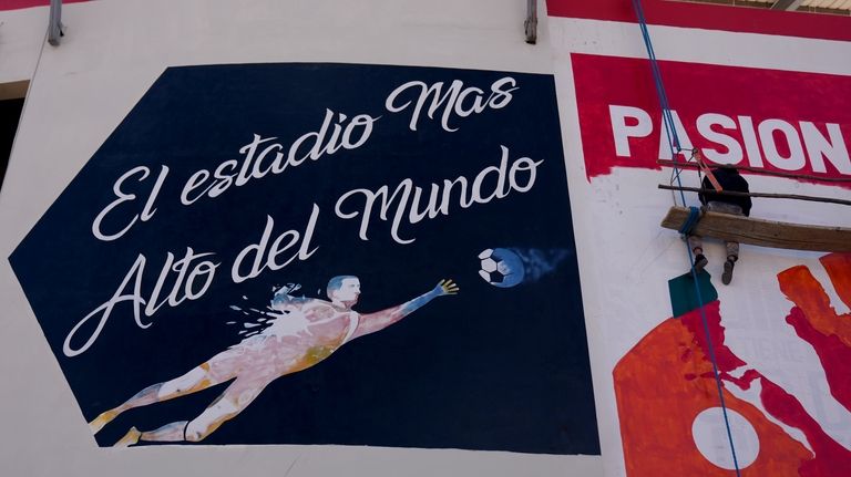 A mural at the Municipal Villa Ingenio stadium reads in...