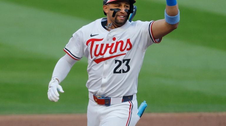 Minnesota Twins' Royce Lewis runs the bases on his two-run...