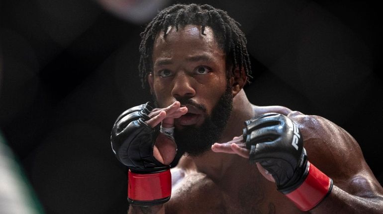 Andre Harrison, right, fights Nazareno Malegarie during a featherweight mixed...