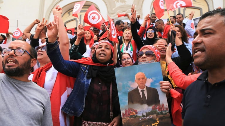 Supporters of Tunisian President Kais Saied stage a demonstration on...
