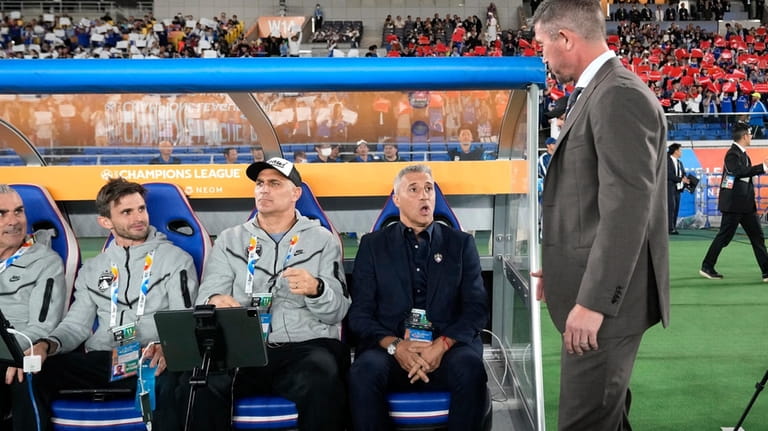 Al Ain's head coach Hernan Crespo, left, reacts as Yokohama...