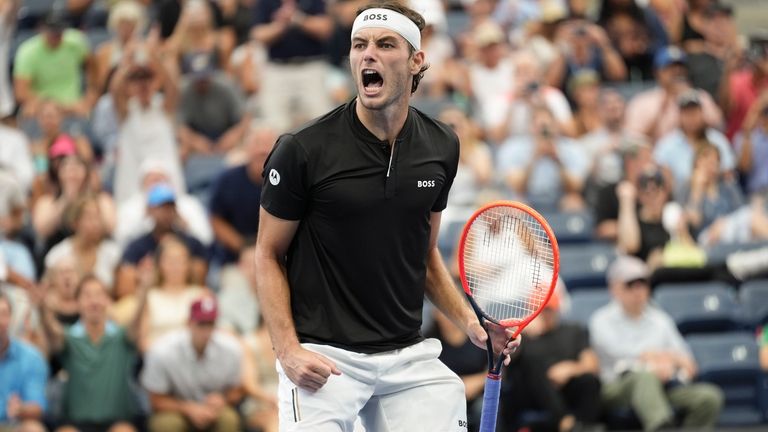 Taylor Fritz, of the United States, reacts after defeating Casper...