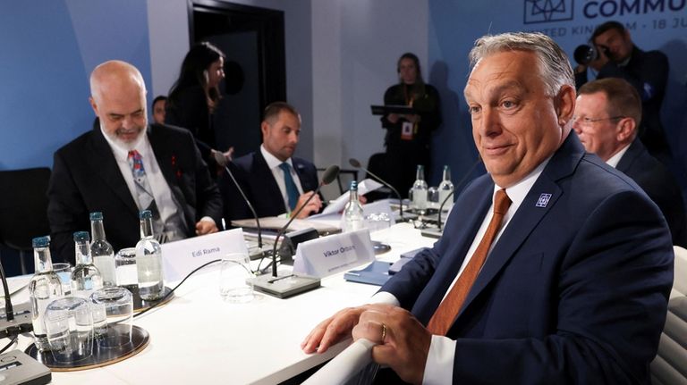 Hungary's Prime Minister Viktor Orban, front right, attends a working...