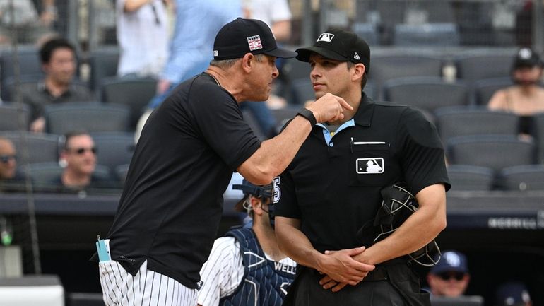 New York Yankees manager Aaron Boone has words with home...