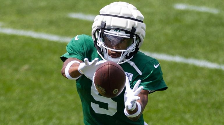 Jets wide receiver Garrett Wilson makes a catch during a...