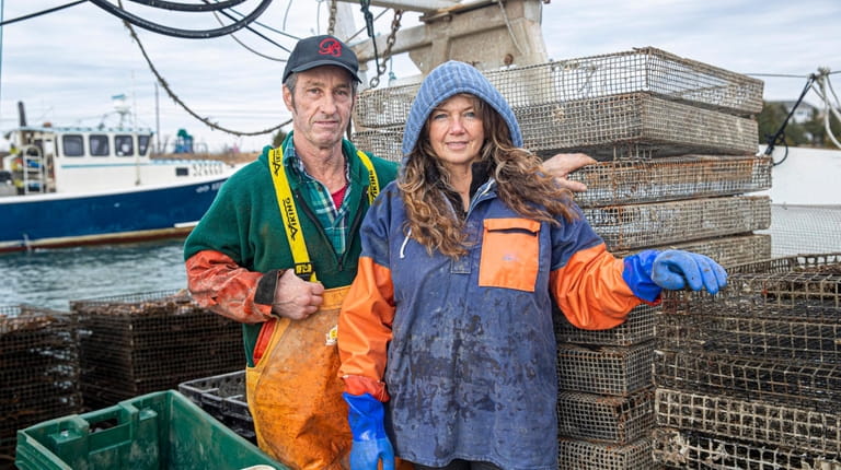 Oyster farmers Mike and Kerrin Craig work off their 42-foot fishing boat....