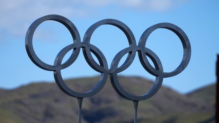 The 2002 Winter Olympic rings are shown outside Rice-Eccles Stadium...
