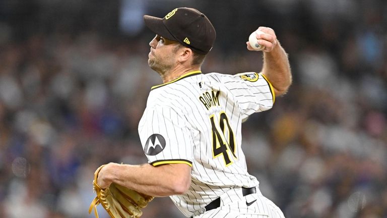 Padres relief pitcher Jason Adam delivers during the eighth inning of...