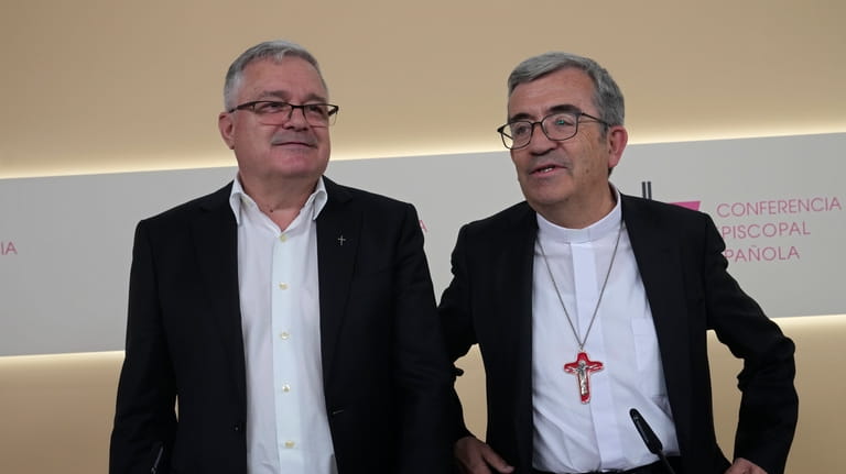 The President of the Spanish Episcopal Conference, Luis Arguello, right...