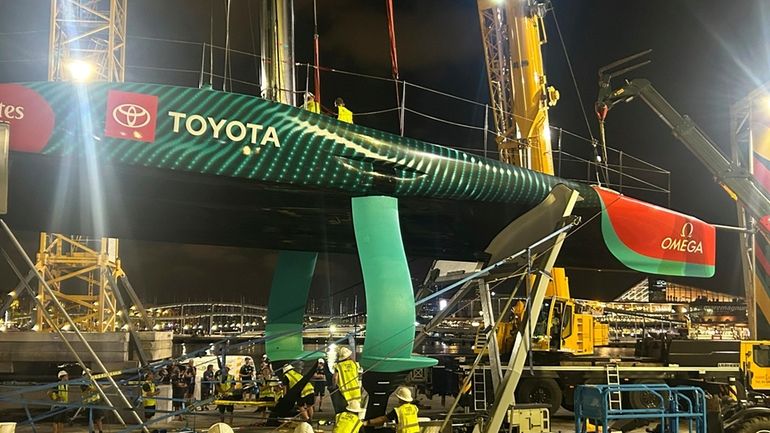 Emirates Team New Zealand inspects the team’s America’s Cup boat...