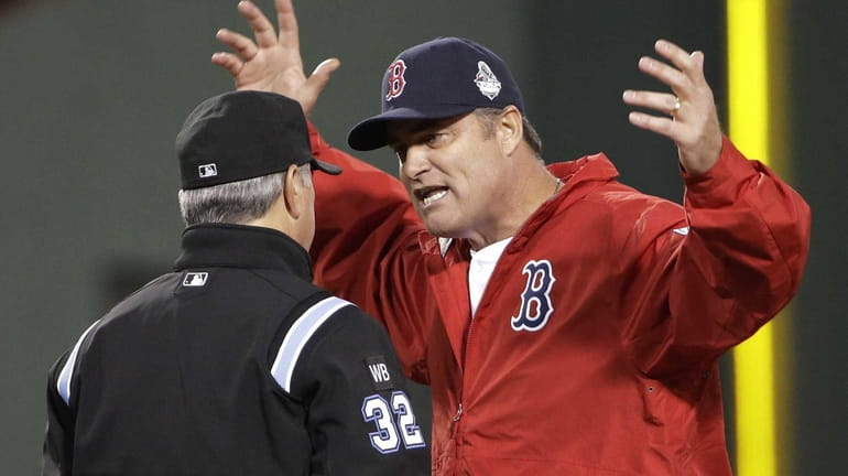 Boston Red Sox manager John Farrell argues a call with...