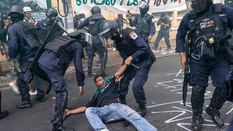 Police remove protesters trying to march to the Asia-Pacific Economic...