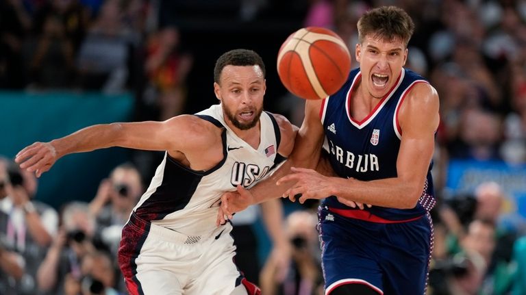 United States' Stephen Curry (4) and Bogdan Bogdanovic (7), of...