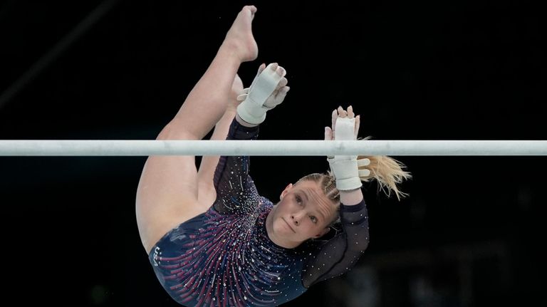 Jade Carey of the United States practices the uneven bars...