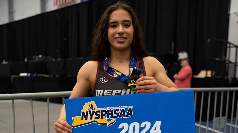 Yianna Foufas of Mepham, winner of the 120lb championship at...