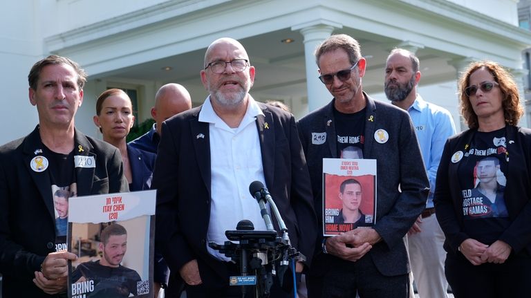 Jonathan Dekel-Chen, center, father of American hostage Sagui Dekel-Chen, along...