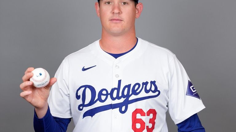 Los Angeles Dodgers starting pitcher Kyle Hurt poses for a...