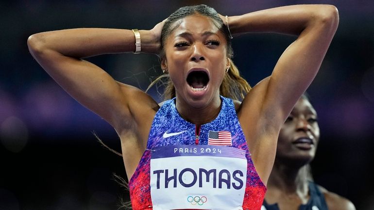 Gabrielle Thomas, of the United States, reacts after winning the...