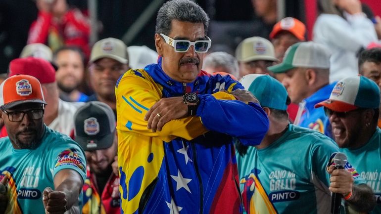 President Nicolas Maduro addresses supporters outside Miraflores presidential palace after...