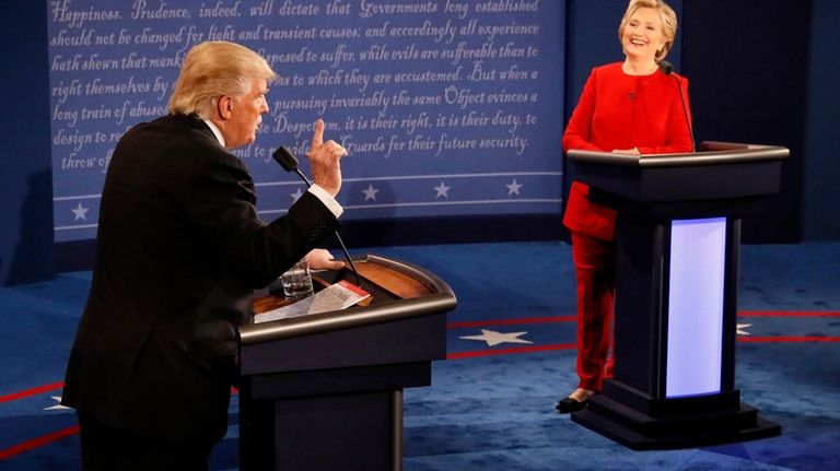 Democratic presidential nominee Hillary Clinton smiles as Republican presidential nominee...