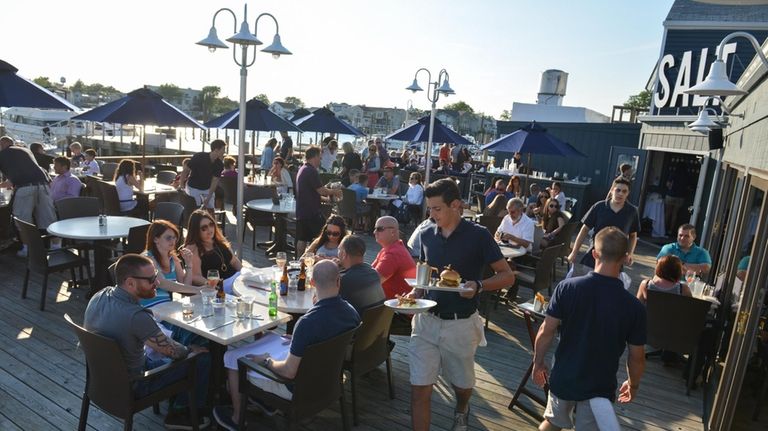 The outdoor dining season continues past Labor Day at Salt...