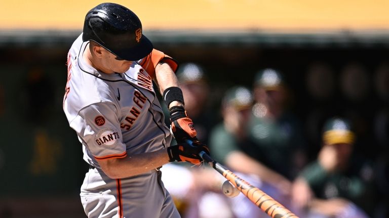 San Francisco Giants' Mark Canha cracks his bat while hitting...