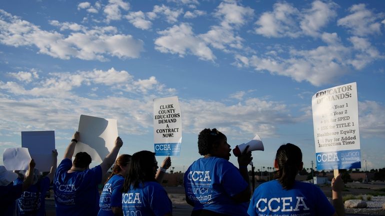 Teachers and members of the Clark County Education Association rally...