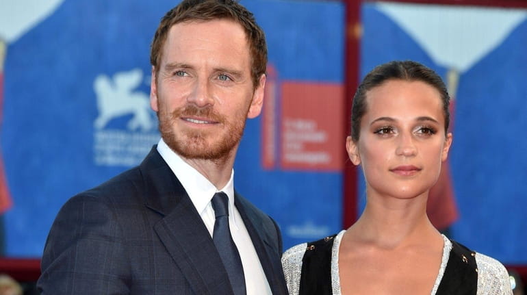 Alicia Vikander and Michael Fassbender step out for a walk with their baby  and some friends