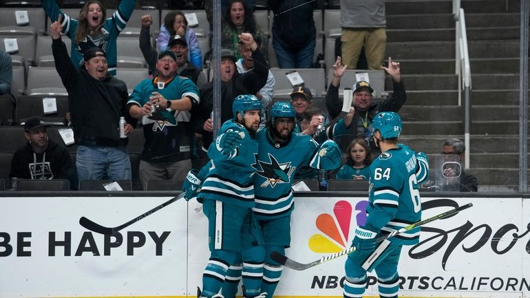 San Jose Sharks left wing Anthony Duclair, center, celebrates with...