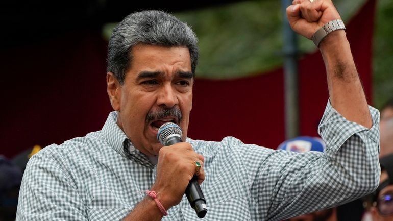 Venezuela's President Nicolas Maduro addresses government loyalists gathered at the...