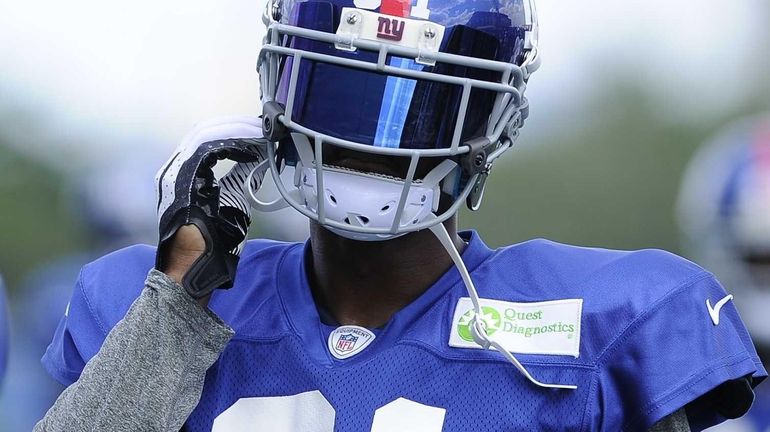 Aaron Ross looks on during training camp. (July 30, 2013)