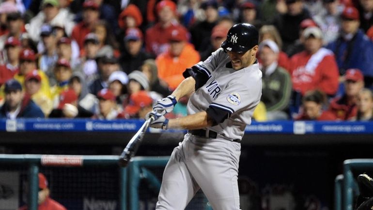 Andy Pettitte singles in the 5th, driving in a run,...