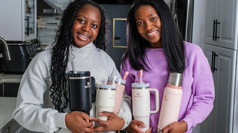 Khalani Dixon, 13, and her mom, Chevonne, display their collection...