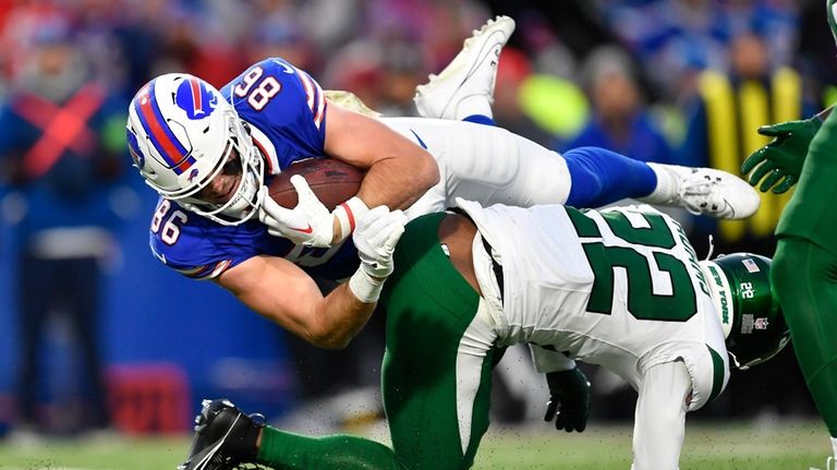 Buffalo Bills tight end Dalton Kincaid (86) is tackled by...