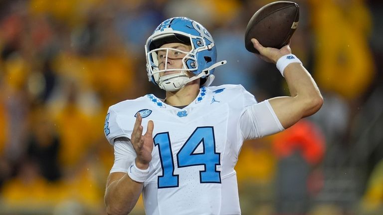 North Carolina quarterback Max Johnson (14) passes during the first...