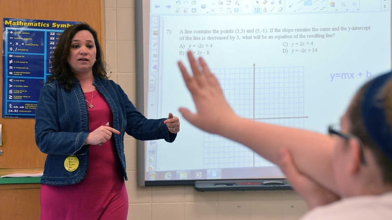 Caryl Lorandini teaches one of her eighth-grade math classes at...