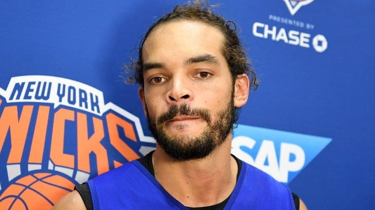 Joakim Noah speaks to the media after practice at training...