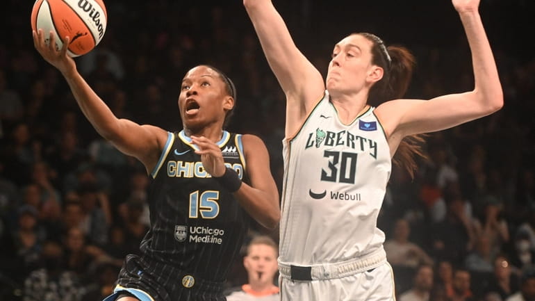 Lindsay Allen #15 of the Chicago Sky, left, looks to...