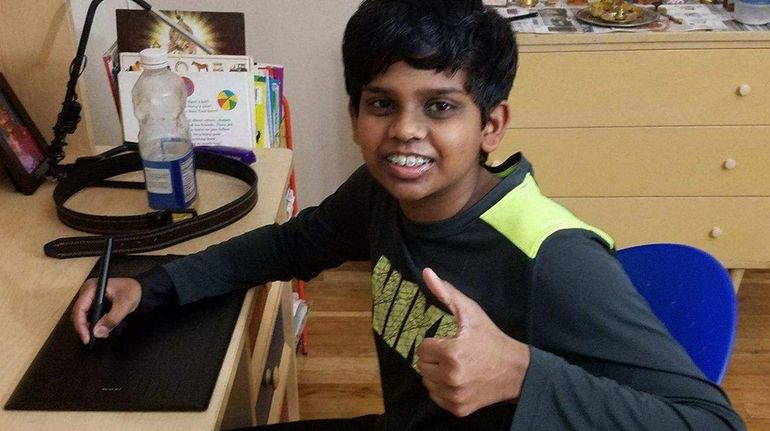 Kidsday reporter Sanjit Gunasekaran with his digital graphics tablet.