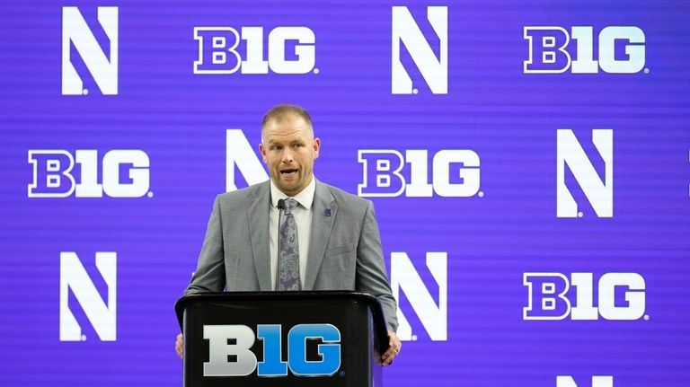 Northwestern head coach David Braun speaks during an NCAA college...