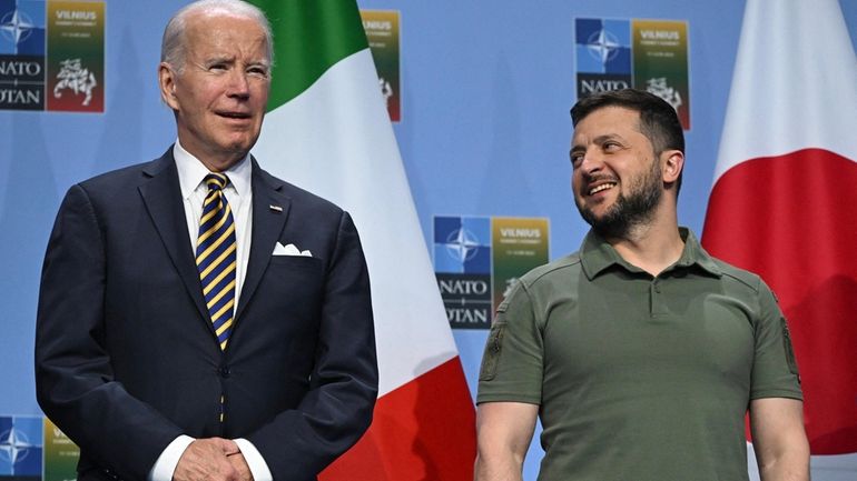 President Joe Biden, left, and Ukrainian President Volodymyr Zelenskyy during...