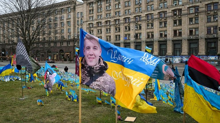 Flags wave at the memorial site for those killed during...