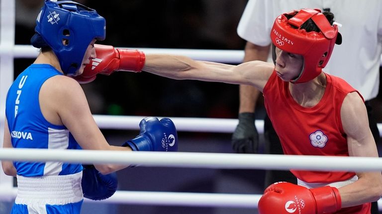 Taiwan's Lin Yu-ting hits Uzbekistan's Sitora Turdibekova in their women's...