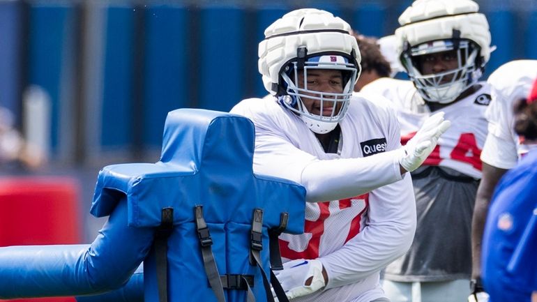 Giants defensive tackle Dexter Lawrence II performs a drill during training...