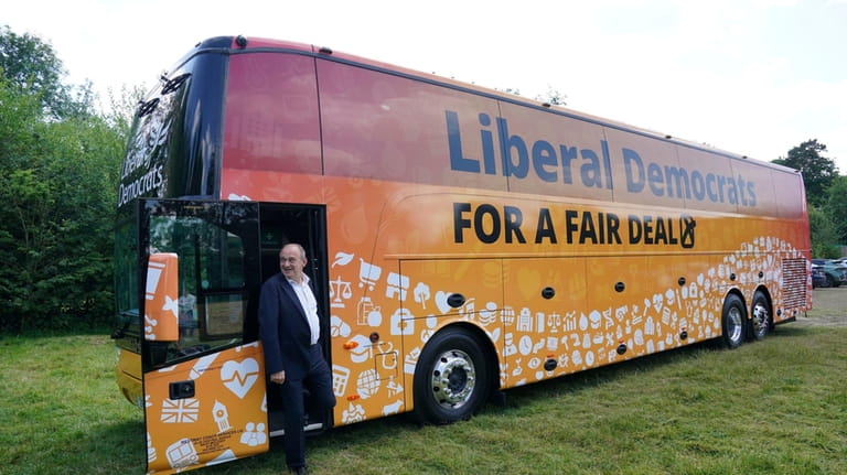 Britain's Liberal Democrat leader Sir Ed Davey arrives to visit...