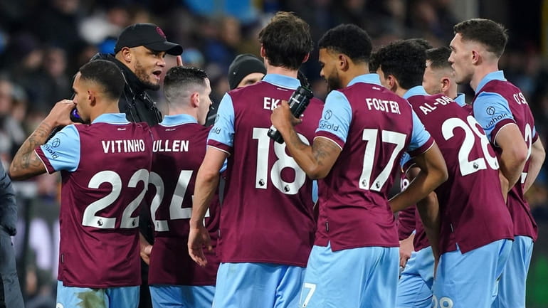 Burnley manager Vincent Kompany addresses his team during their English...