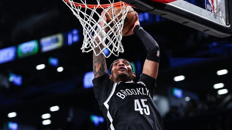 Keon Johnson of the Nets dunks the ball during the...