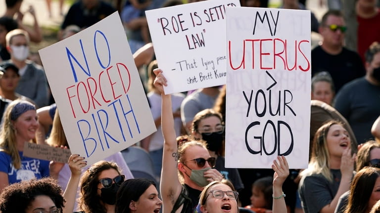 Abortion-rights protesters cheer at a rally, June 24, 2022, in...