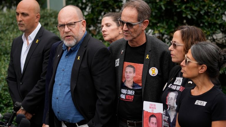 Jonathan Dekel-Chen, second left, father of American hostage Sagui Dekel-Chen,...