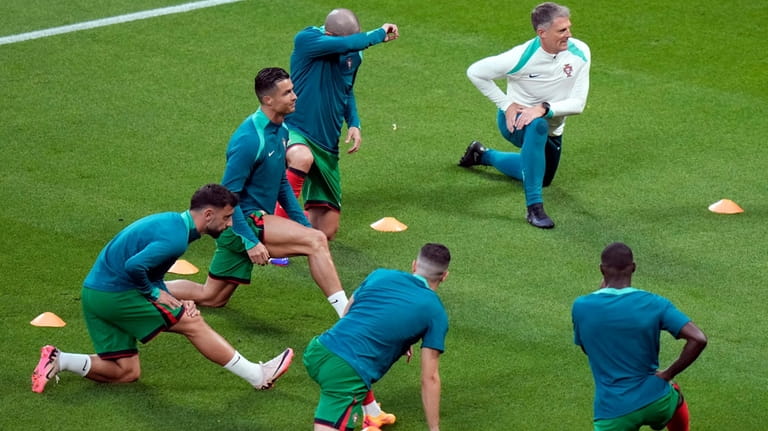 Portugal's Cristiano Ronaldo, second from left, warms up before a...